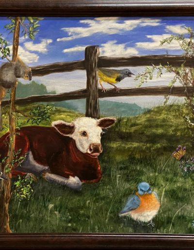 painting of pastoral setting with brown and white calf laying in the grass in front of wooden fence. A squirrel, woodpecker, robin, another bird with yellow breast and butterflies are also basking in the sunshine.