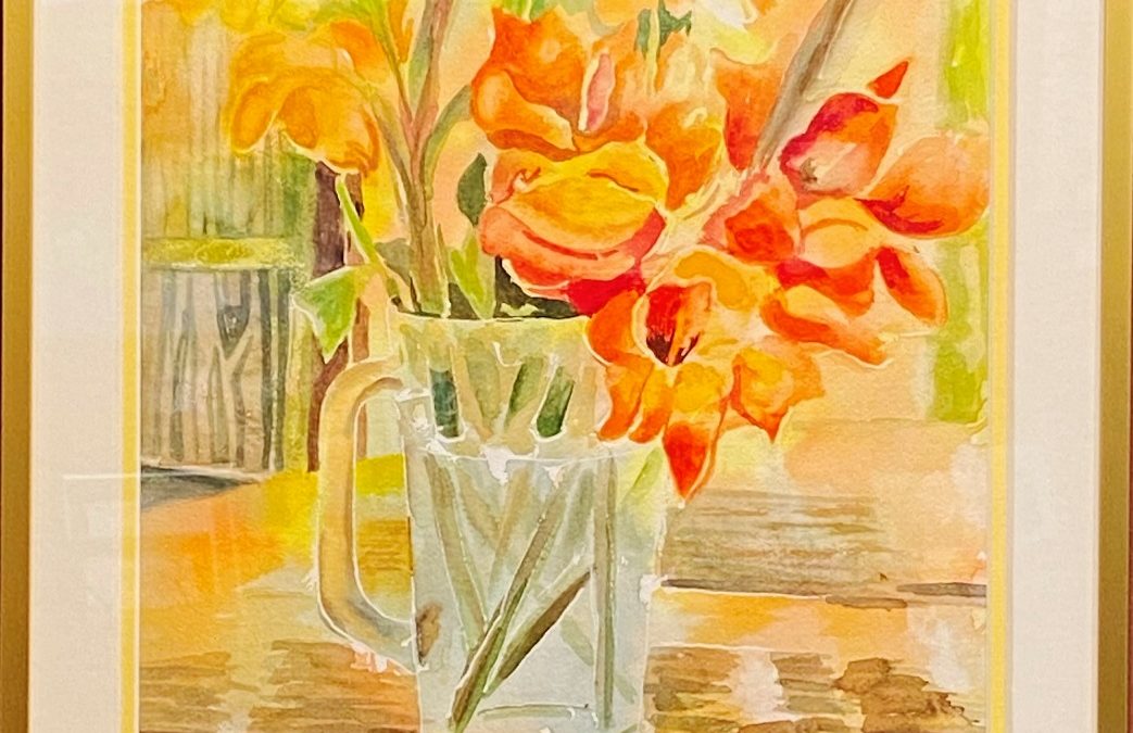 Still life painting of bright and cheery flowers in yellows and oranges