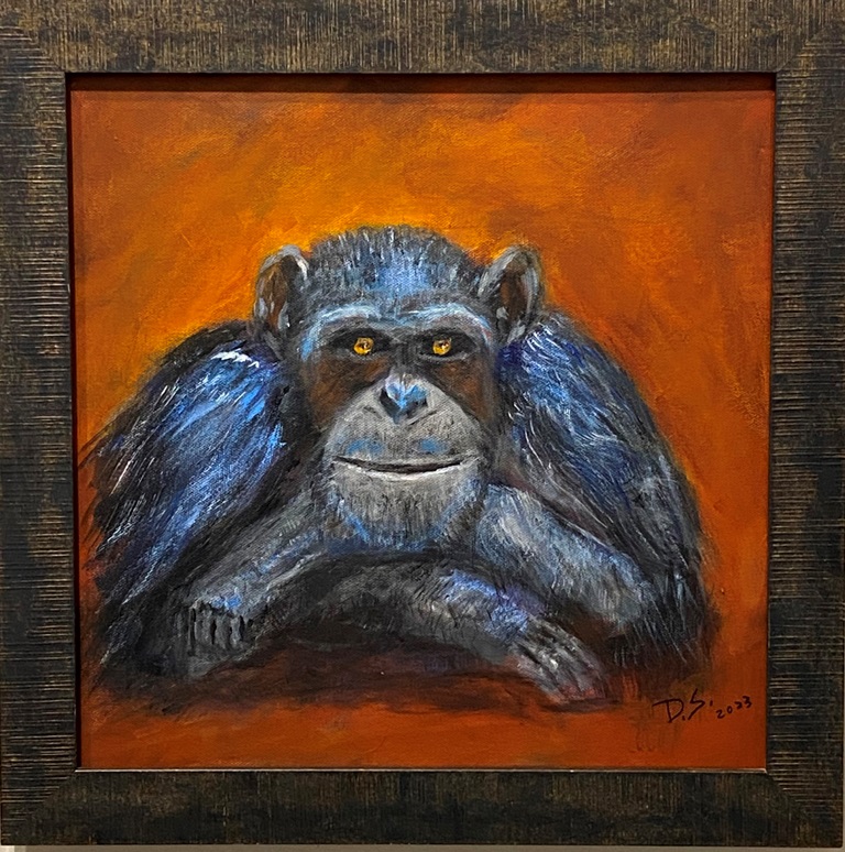 painting of monkey looking at the viewer with elbows propped on surface, arms crossed and chin resting on arms Monkey is black and gray with dark orange background