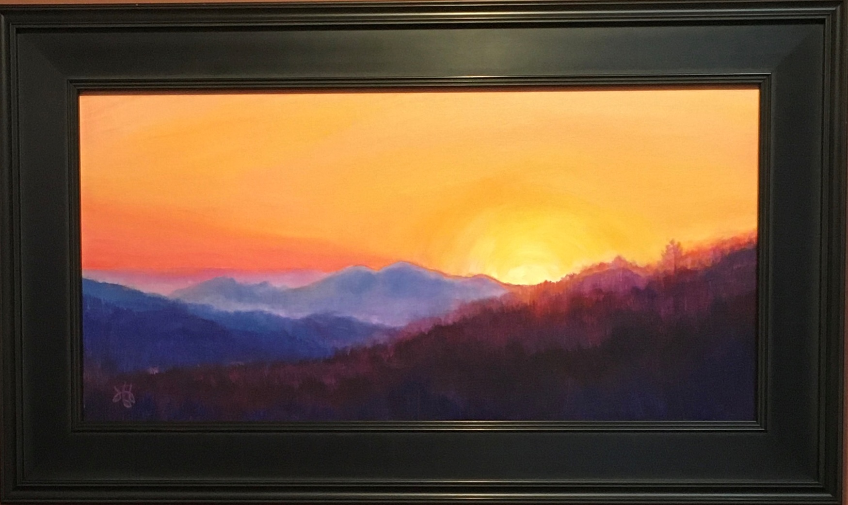 oil painting of yellow and orange sunset sky over purple and blue mountains
