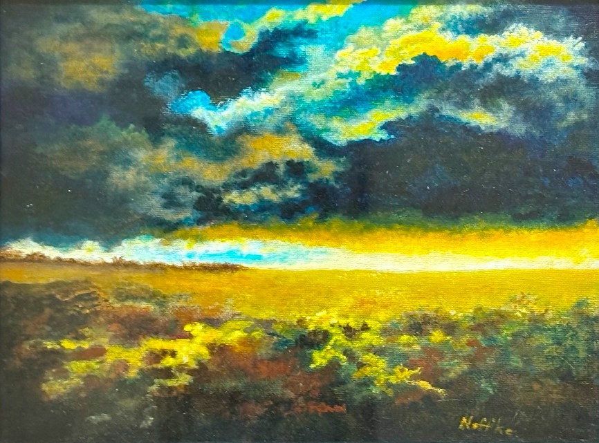 striking painting of a large vista with high contrast dark clouds and foreground but very bright yellow bursting from below the clouds and lighting up the area below. There is some bright blue above the dark part of the clouds adding to the overall almost breathtaking color tableau