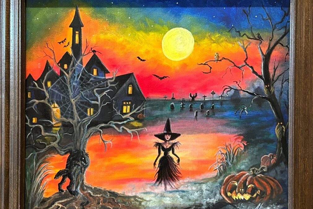 Halloween scene with bright yellow moon against orange and blue sky. There's a creepy house in the background and a witch in the foreground standing in mist