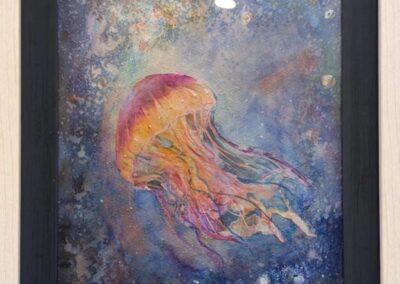Water color painting of a jelly fish in the ocean. The entire image is multicolor with blues and purples in the water and shades of reds and yellows in the jelly fish